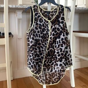 Animal print chiffon with black line. Yellow piping , longer in the back